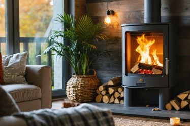 A cozy living room showcasing a modern pellet stove, symbolizing energy efficiency and sustainability with warmth emanating from the stove.