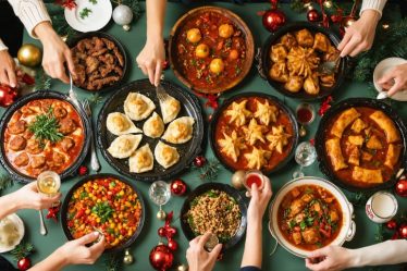 A vibrant and diverse holiday table showcasing traditional dishes from Italy, Germany, China, Mexico, and Brazil, emphasizing cultural connections through food.