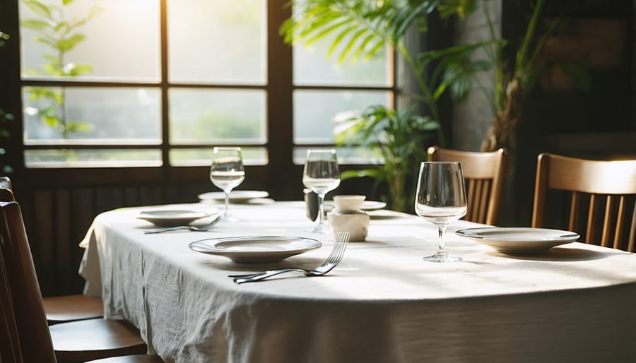 Peaceful dining space with natural lighting, plants, and clutter-free table setting