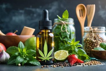 A glass bottle of CBD oil prominently displayed among colorful culinary ingredients, illustrating the blend of wellness and flavor in cooking.