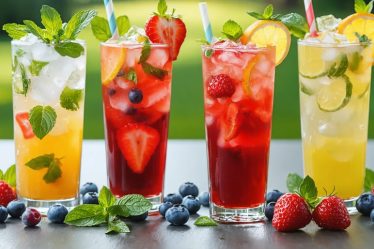 An array of colorful mocktails, including a Virgin Mojito Sparkler and Berry Basil Fizz, beautifully garnished with mint, berries, and citrus slices. The drinks are set on an elegantly styled garden party table, showcasing the vibrancy and sophistication of non-alcoholic beverages.