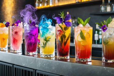 A modern home bar setup with an assortment of visually stunning craft cocktails including butterfly pea flower, smoky old fashioned, and lavender gin fizz, surrounded by cocktail tools and vibrant garnishes.