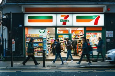 A bustling street corner at dusk with a modern, brightly lit 7-Eleven store. Customers are seen entering and interacting with digital maps, depicting the convergence of physical location strategy and digital convenience.