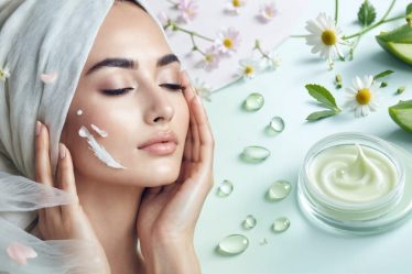 A serene face being cared for with gentle touches and enveloped in a silk cloth, surrounded by illustrations of soothing ingredients like aloe vera and chamomile against a pastel background, representing a nurturing skincare routine for sensitive skin.