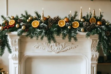 A stunning DIY holiday garland made from pine branches, dried orange slices, and decorative berries, elegantly draped across a mantel in a festive room.