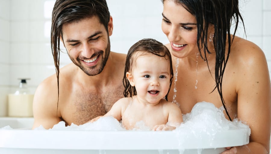 Mother and father giving their toddler a bath together, demonstrating cooperative parenting